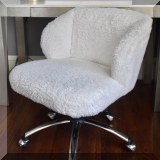 F30. Pottery Barn rolling desk chair with faux fur upholstery. 30”h x 24”w x 24”d 